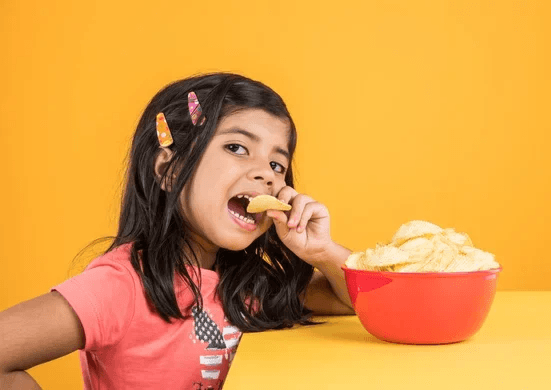 Girl eating chips